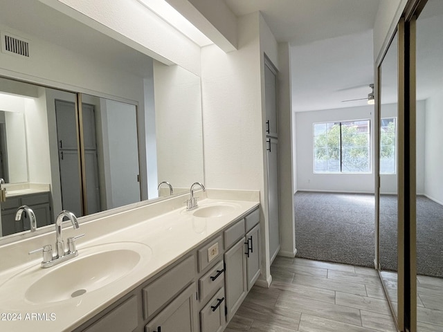 bathroom featuring vanity and ceiling fan