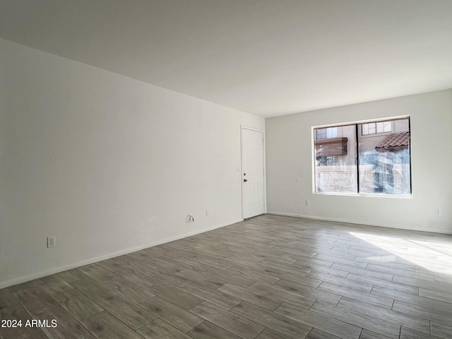 empty room featuring wood-type flooring