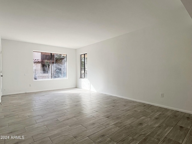 unfurnished room featuring light hardwood / wood-style floors