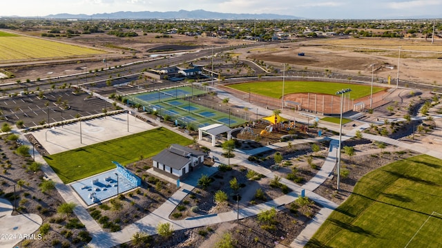 birds eye view of property with a mountain view