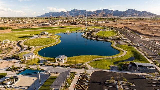 birds eye view of property with a water and mountain view