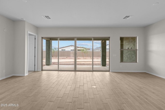 12311 W Parkway Ln, Avondale, AZ 85323 - empty room featuring light wood finished floors and baseboards