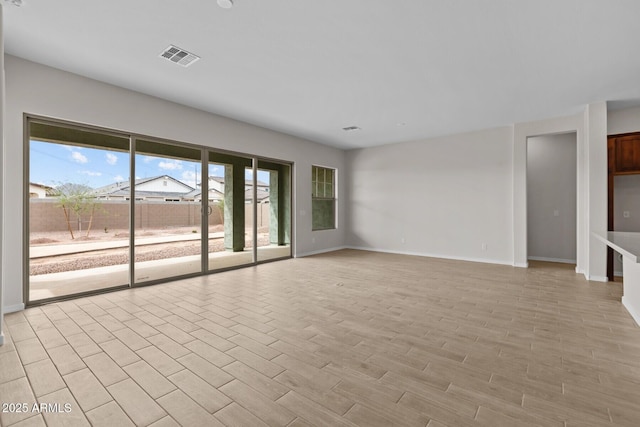 12311 W Parkway Ln, Avondale, AZ 85323 - empty room featuring baseboards and light wood-style floors