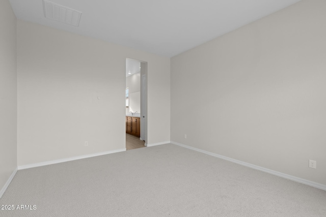 12311 W Parkway Ln, Avondale, AZ 85323 - empty room with light carpet and baseboards