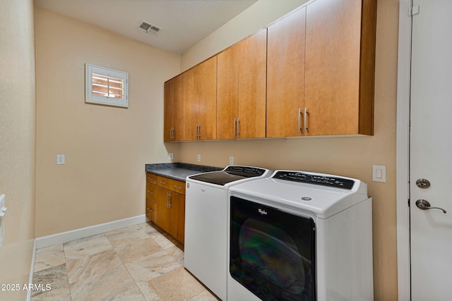 laundry area with cabinets and washing machine and dryer