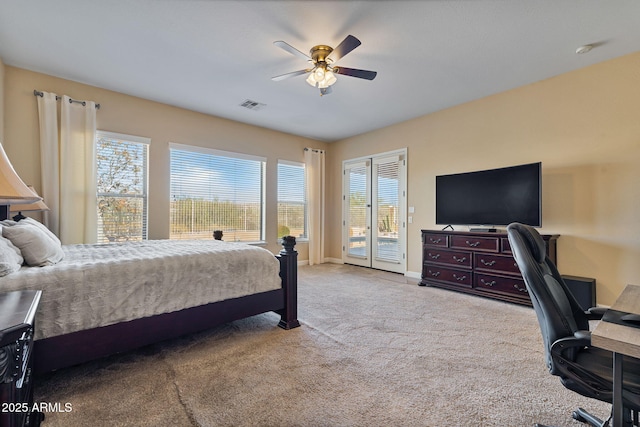 bedroom featuring light carpet, access to outside, and ceiling fan