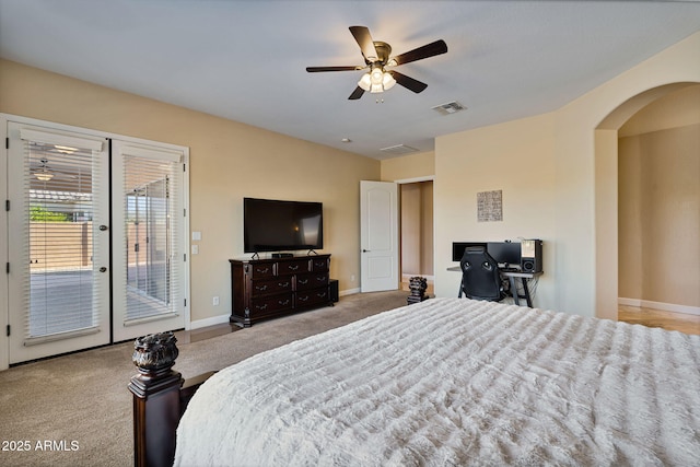 carpeted bedroom featuring ceiling fan and access to exterior