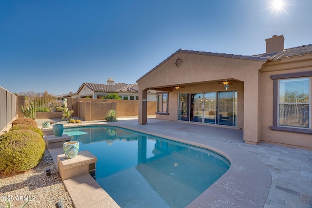 view of pool featuring a patio and ceiling fan