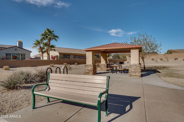 surrounding community with a gazebo and a patio