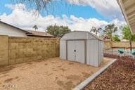 view of shed with a fenced backyard