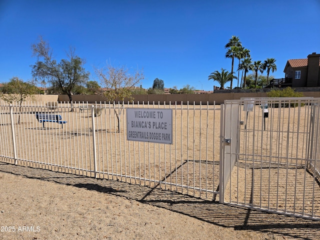 exterior space with a gate and fence