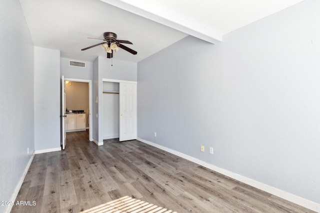 3641 E Park Ave, Phoenix, AZ 85044 - unfurnished bedroom with wood finished floors, a closet, baseboards, ceiling fan, and beam ceiling
