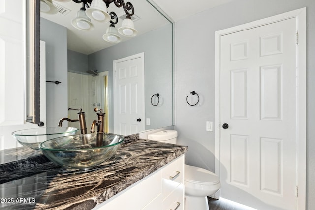 3641 E Park Ave, Phoenix, AZ 85044 - bathroom with vanity, toilet, a chandelier, and a shower