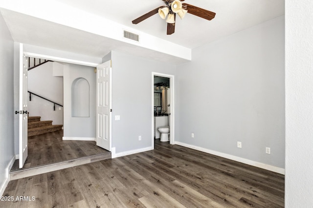 3641 E Park Ave, Phoenix, AZ 85044 - unfurnished room with ceiling fan, wood finished floors, baseboards, and stairs
