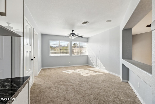 3641 E Park Ave, Phoenix, AZ 85044 - unfurnished living room with light carpet, ceiling fan, and baseboards