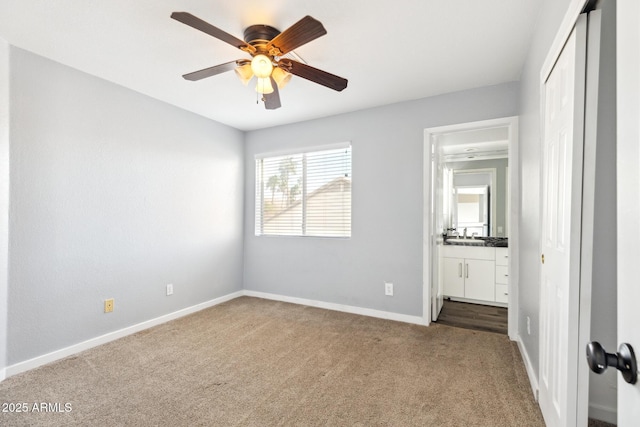 3641 E Park Ave, Phoenix, AZ 85044 - unfurnished bedroom with carpet floors, baseboards, connected bathroom, a closet, and ceiling fan