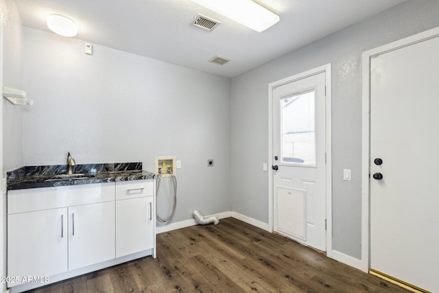 3641 E Park Ave, Phoenix, AZ 85044 - washroom with electric dryer hookup, hookup for a washing machine, dark wood-style floors, cabinet space, and baseboards