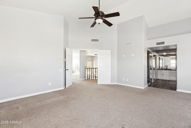3641 E Park Ave, Phoenix, AZ 85044 - unfurnished living room with carpet flooring, baseboards, ceiling fan, and high vaulted ceiling