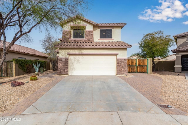 mediterranean / spanish house featuring a garage