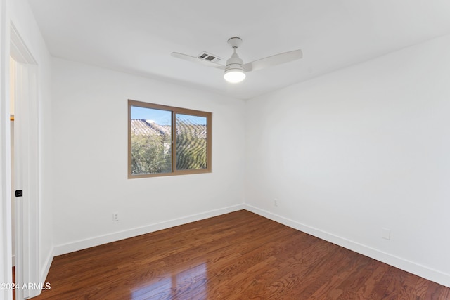 unfurnished room with dark hardwood / wood-style floors and ceiling fan