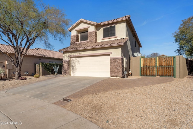 mediterranean / spanish-style home featuring a garage