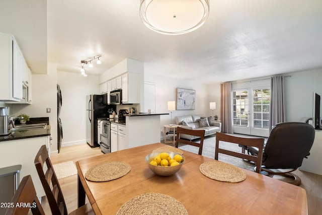 dining area with light hardwood / wood-style floors