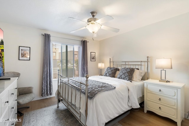 bedroom with light hardwood / wood-style flooring and ceiling fan