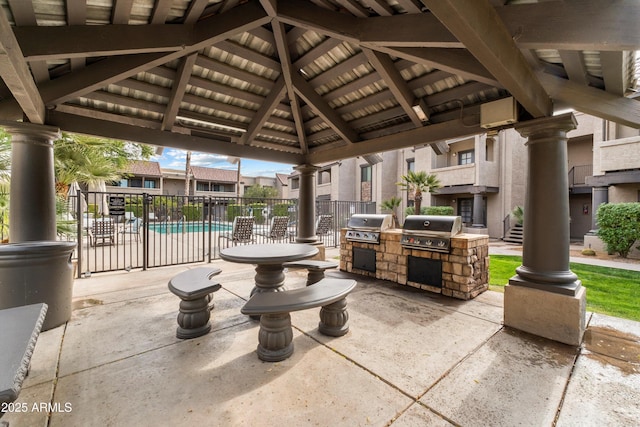 view of patio with a gazebo, area for grilling, grilling area, and a community pool