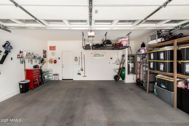 22403 W Harrison St, Buckeye, AZ 85326 - garage featuring a garage door opener and electric water heater