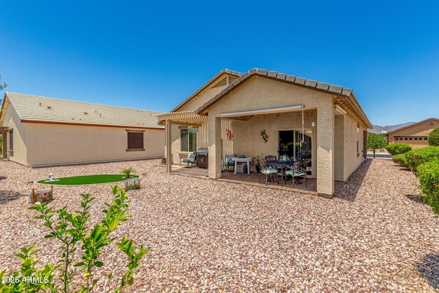 22403 W Harrison St, Buckeye, AZ 85326 - back of property featuring stucco siding and a patio
