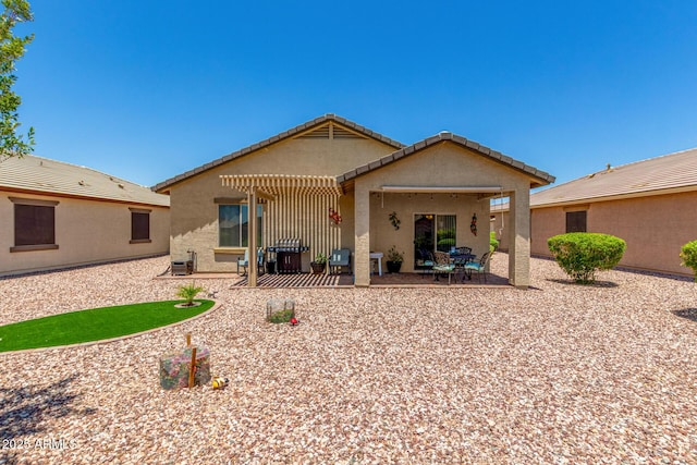 22403 W Harrison St, Buckeye, AZ 85326 - rear view of house featuring stucco siding, a patio area, and a tile roof