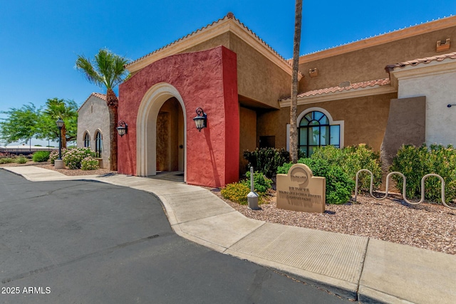 22403 W Harrison St, Buckeye, AZ 85326 - view of front of property with stucco siding and a tiled roof
