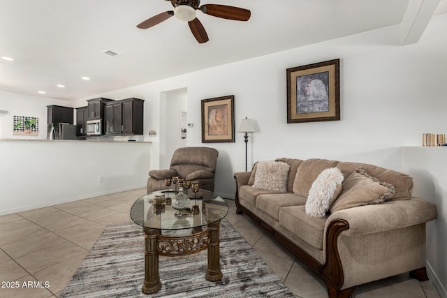 22403 W Harrison St, Buckeye, AZ 85326 - living room with light tile patterned flooring, ceiling fan, and recessed lighting