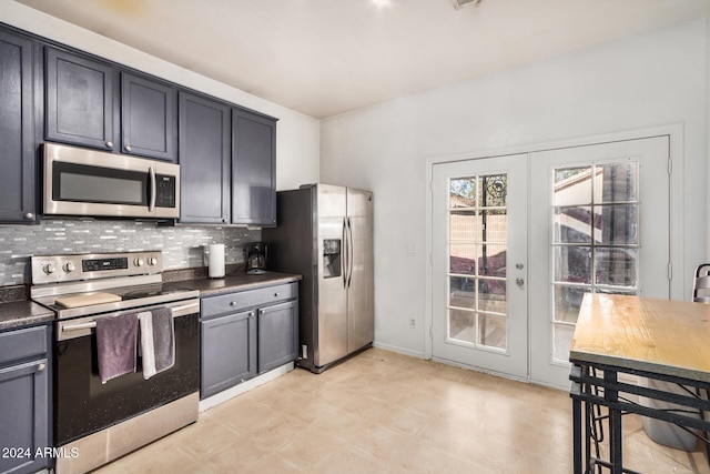 kitchen featuring decorative backsplash, stainless steel appliances, and french doors