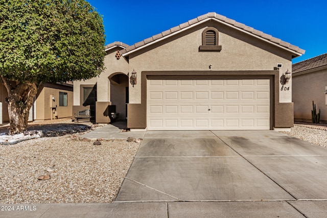 view of front of property with a garage