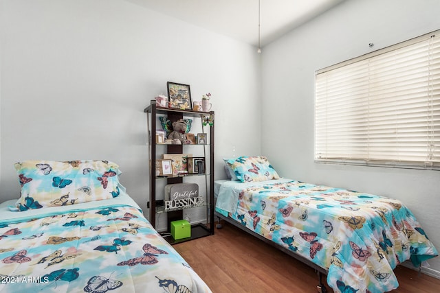 bedroom with hardwood / wood-style flooring