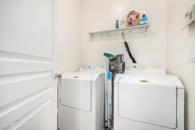 laundry room featuring washing machine and clothes dryer