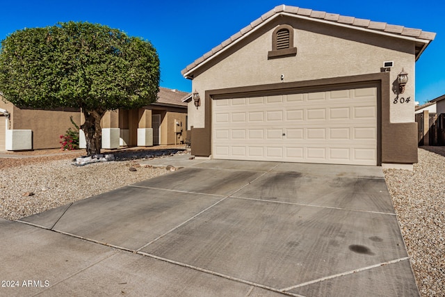 view of front of home with a garage