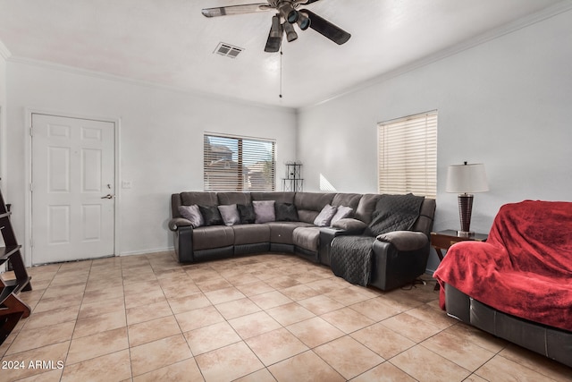 living room with ceiling fan, light tile patterned floors, and ornamental molding