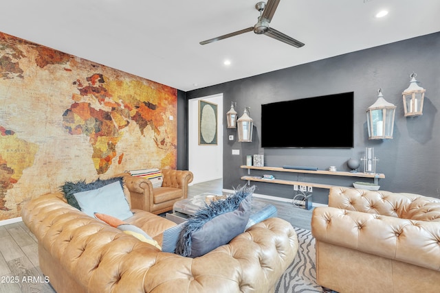 living room with wood-type flooring and ceiling fan