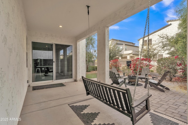 view of patio / terrace with a fire pit