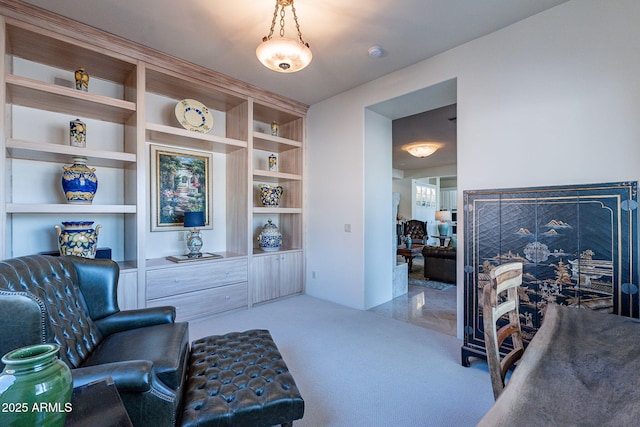 sitting room with carpet floors