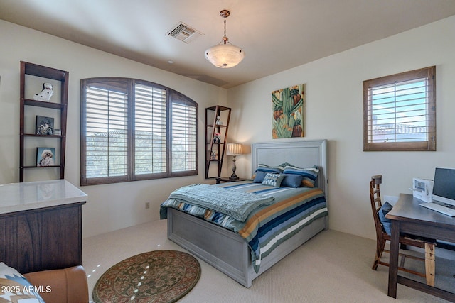 bedroom featuring carpet floors and visible vents