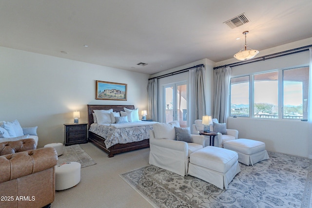 bedroom with multiple windows, carpet, and visible vents