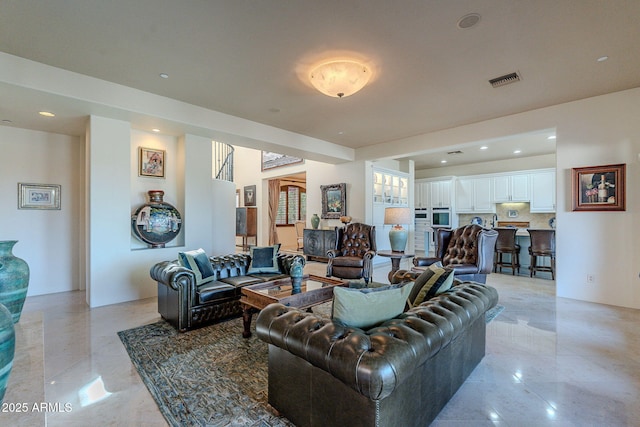 living area with recessed lighting