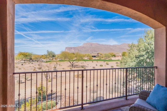 balcony featuring a mountain view