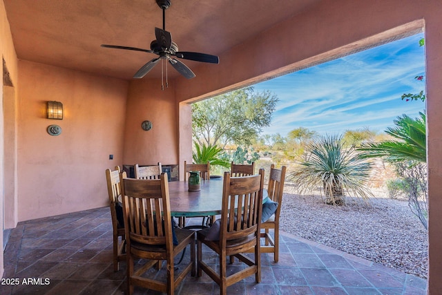 view of patio / terrace with a ceiling fan and outdoor dining area