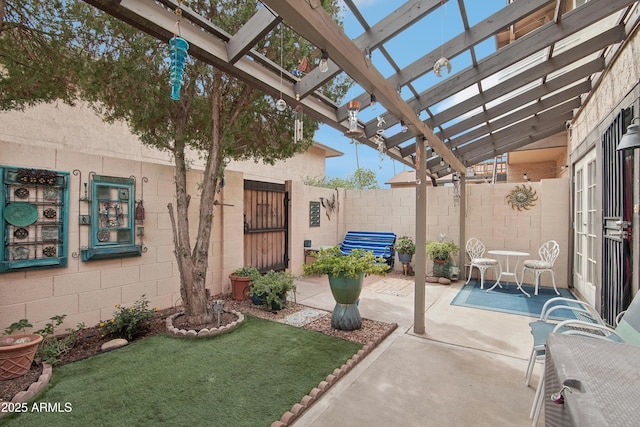 view of patio with fence, a gate, and a pergola