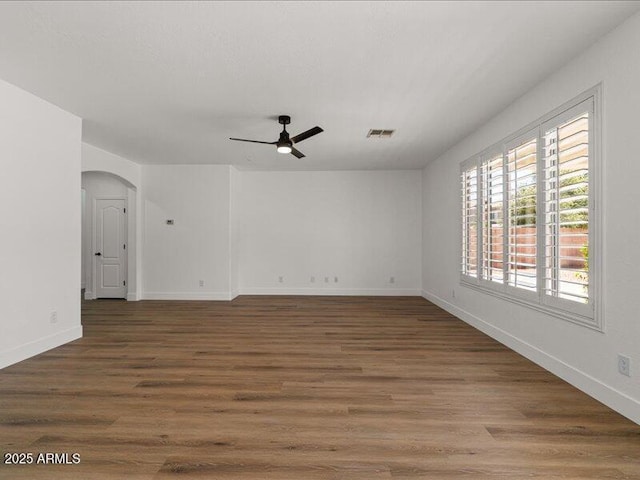 271 W Roadrunner Dr, Chandler, AZ 85286 - spare room with a ceiling fan, visible vents, arched walkways, wood finished floors, and baseboards