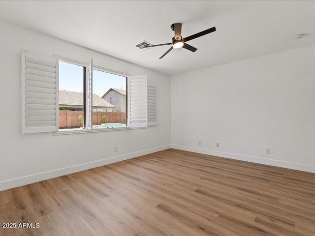 271 W Roadrunner Dr, Chandler, AZ 85286 - spare room featuring visible vents, a ceiling fan, baseboards, and wood finished floors